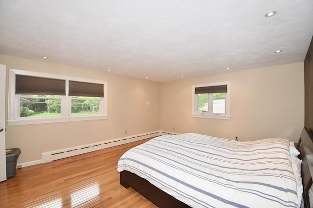 166 Primrose Dr, Longmeadow, MA 01106 - bedroom featuring a baseboard heating unit, wood finished floors, recessed lighting, and baseboards