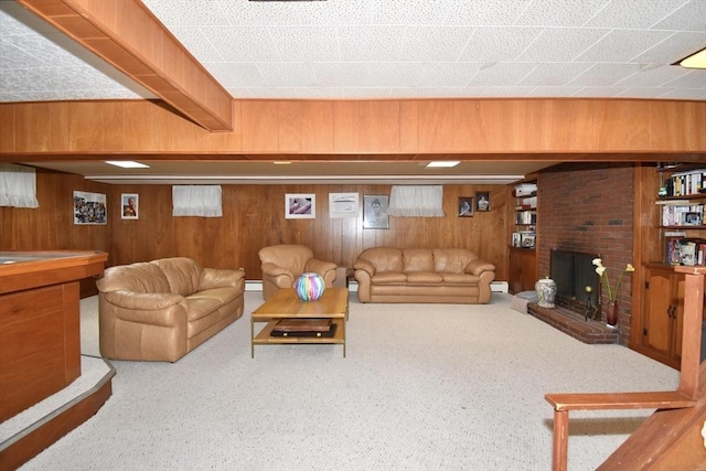 166 Primrose Dr, Longmeadow, MA 01106 - living room with wood walls, a fireplace, carpet, and a baseboard radiator