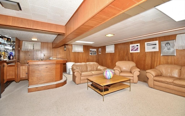 166 Primrose Dr, Longmeadow, MA 01106 - carpeted living room with wooden walls and a bar