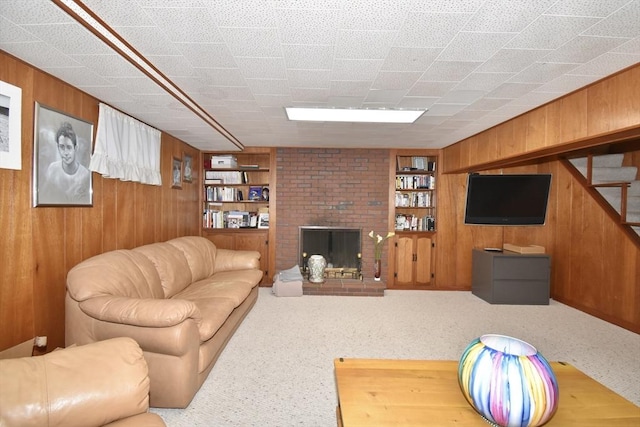 166 Primrose Dr, Longmeadow, MA 01106 - living area featuring wooden walls, built in features, carpet, and a fireplace