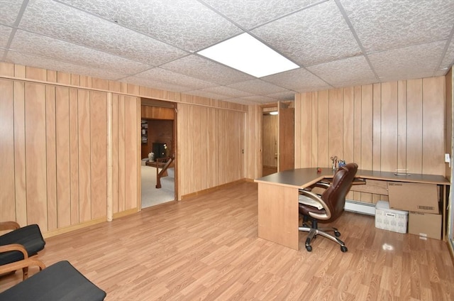 166 Primrose Dr, Longmeadow, MA 01106 - home office featuring wood finished floors, a baseboard heating unit, a paneled ceiling, wood walls, and baseboards