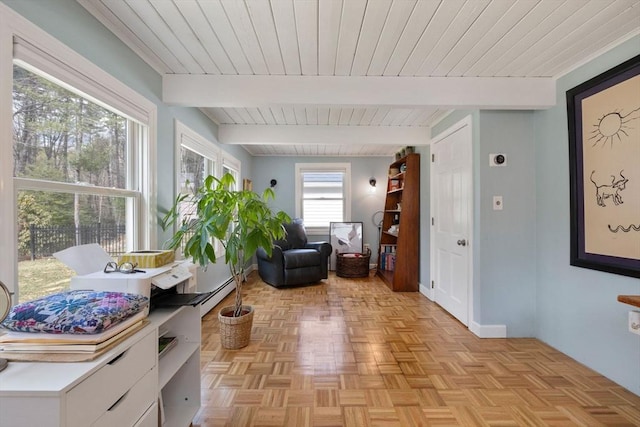 interior space featuring beam ceiling and baseboard heating