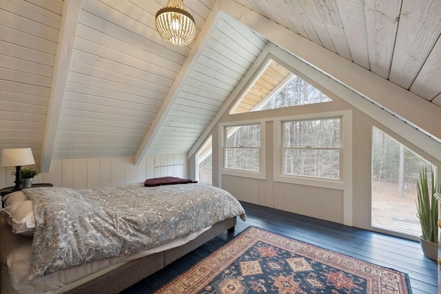 bedroom with wooden ceiling, an inviting chandelier, lofted ceiling with beams, hardwood / wood-style flooring, and access to exterior