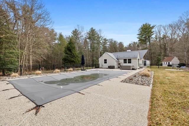 view of pool featuring a patio, fence, and a lawn