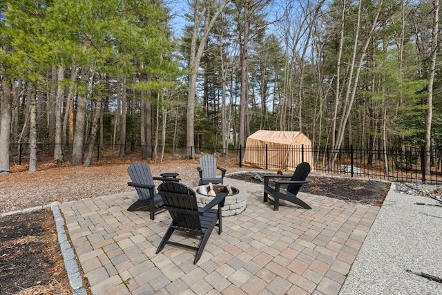 view of patio / terrace featuring an outdoor fire pit and a fenced backyard