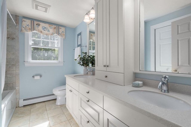 bathroom with baseboard heating, toilet, double vanity, and tile patterned floors