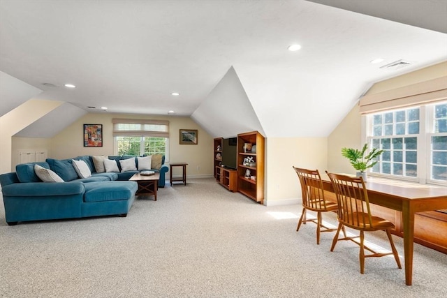 living room featuring light colored carpet, lofted ceiling, baseboards, and recessed lighting