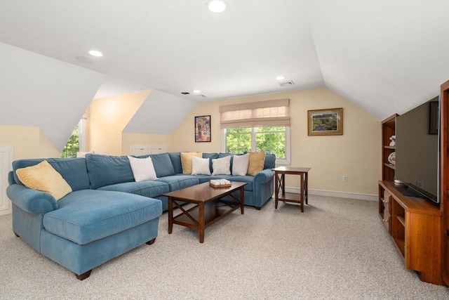 living area featuring light colored carpet, lofted ceiling, baseboards, and recessed lighting