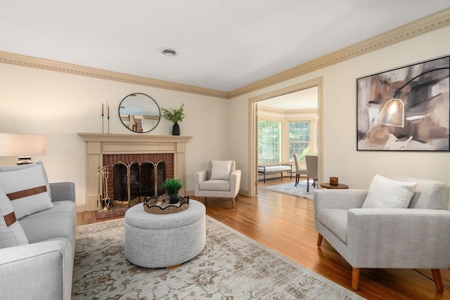 living room with wood finished floors and a fireplace