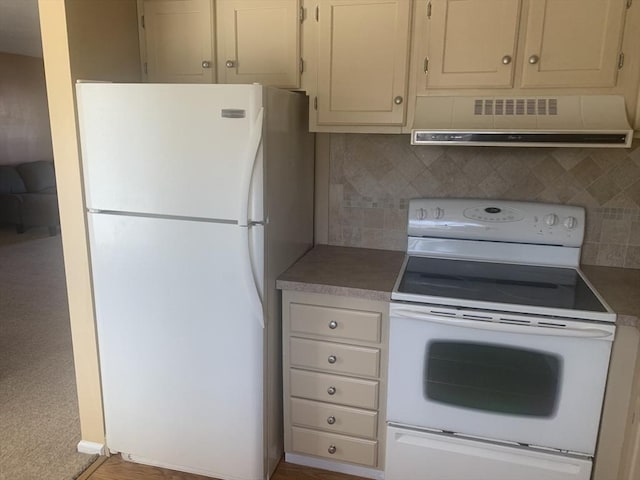 kitchen featuring white appliances, ventilation hood, light countertops, and tasteful backsplash