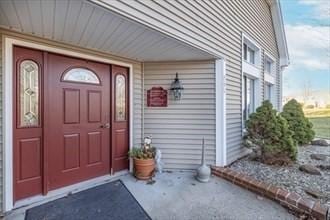 doorway to property featuring covered porch