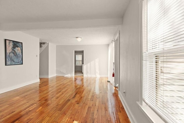 unfurnished room featuring hardwood / wood-style floors