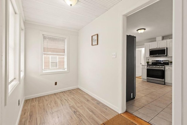 spare room featuring light hardwood / wood-style floors