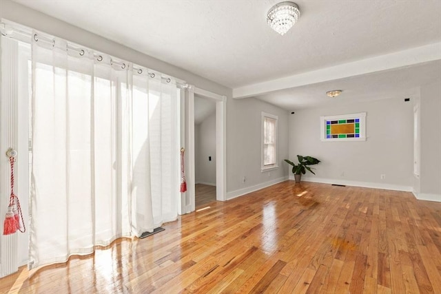 unfurnished room with light hardwood / wood-style floors