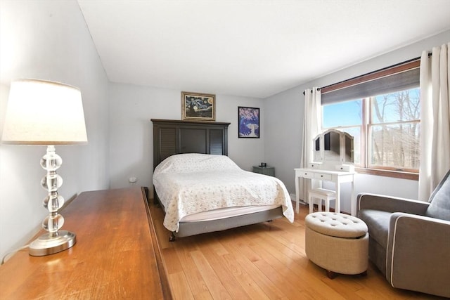 bedroom with light wood finished floors