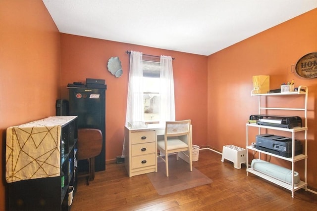 office featuring baseboards and wood finished floors