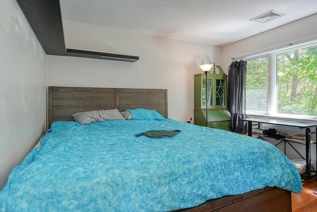 bedroom with wood finished floors