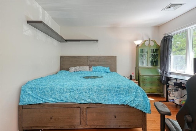 bedroom featuring wood finished floors