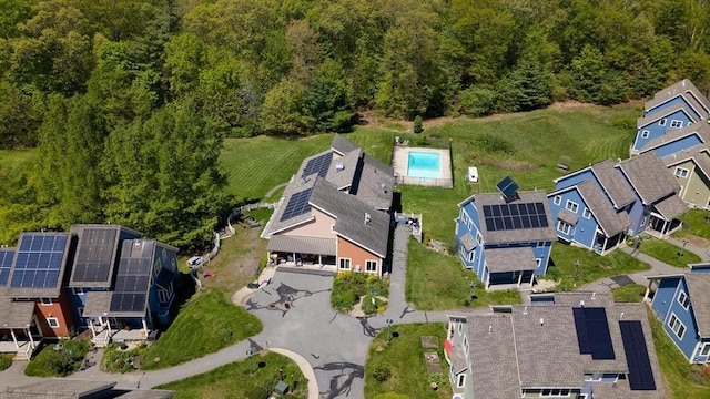 view of property location featuring a forest