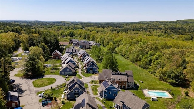 aerial view of residential area featuring a heavily wooded area