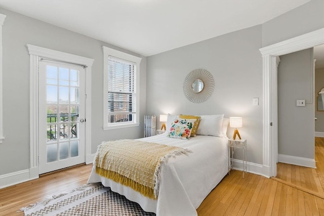 72 Strathmore Rd Unit 10B, Boston, MA 02135 - bedroom featuring wood-type flooring, baseboards, and access to outside