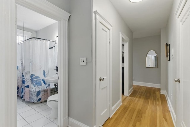72 Strathmore Rd Unit 10B, Boston, MA 02135 - hall featuring baseboards and light wood-style flooring