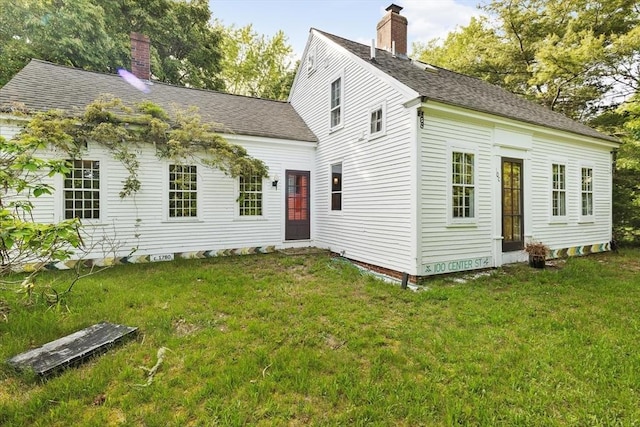100 Center St, Dennis, MA 02660 - view of front of property featuring a chimney, a front lawn, and a shingled roof