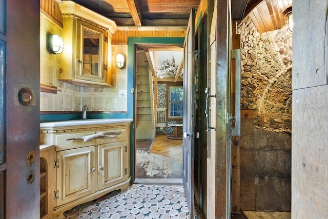 100 Center St, Dennis, MA 02660 - bathroom featuring wooden ceiling, vanity, and wood walls