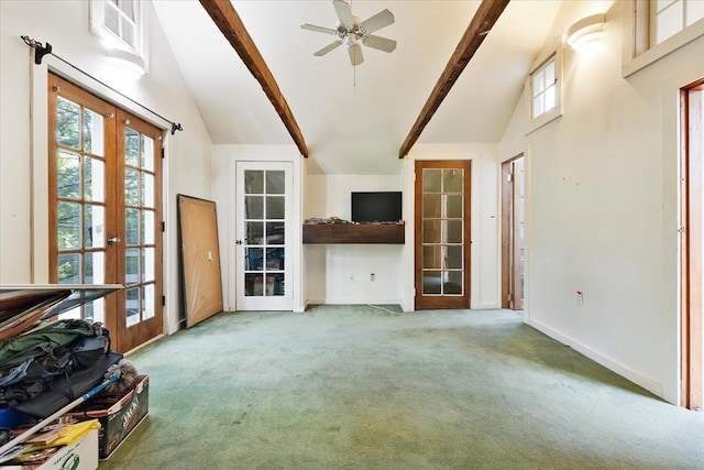 100 Center St, Dennis, MA 02660 - unfurnished living room with french doors, carpet floors, beam ceiling, high vaulted ceiling, and a ceiling fan