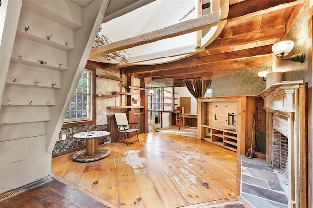 100 Center St, Dennis, MA 02660 - unfurnished living room featuring hardwood / wood-style floors and a fireplace
