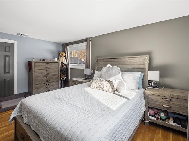 bedroom featuring dark hardwood / wood-style flooring