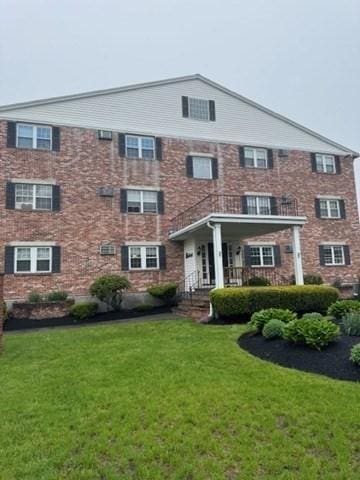 305 Pine St Unit 18, Lowell, MA 01851 - townhome / multi-family property featuring a front lawn