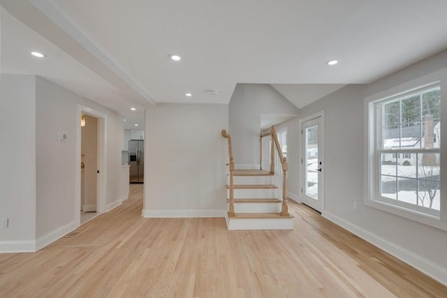 foyer featuring recessed lighting, light wood-style flooring, baseboards, and stairs