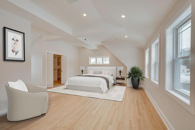 bedroom with baseboards, recessed lighting, and light wood-style floors