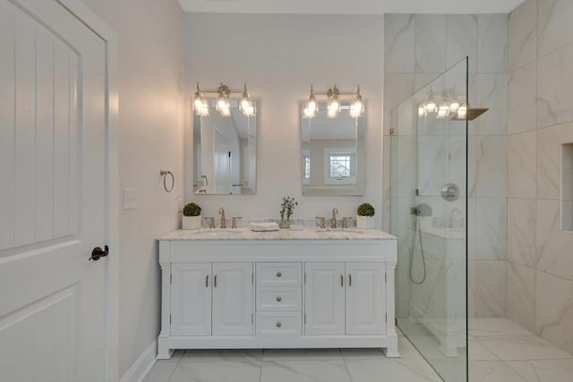 full bathroom featuring double vanity, marble finish floor, a walk in shower, and a sink