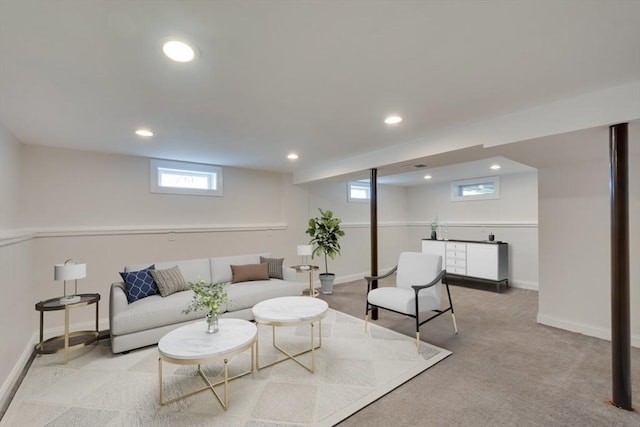 living room featuring recessed lighting, light carpet, and baseboards