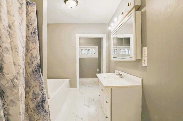 130 Franklin St, Milford, NH 03055 - full bathroom with marble look tiles, a bathtub, baseboards, vanity, and a shower with shower curtain