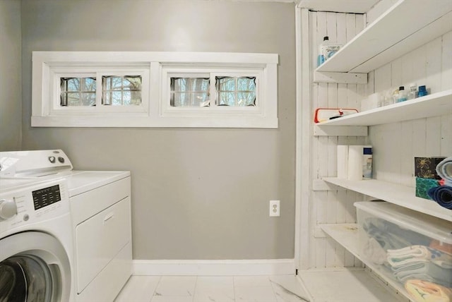 130 Franklin St, Milford, NH 03055 - laundry area with washing machine and dryer, marble look tiles, and baseboards