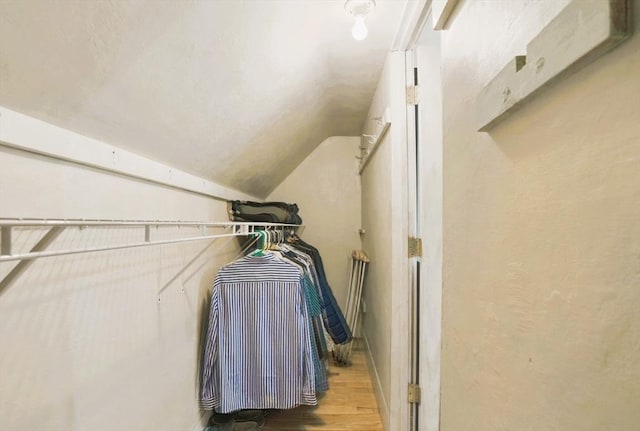 130 Franklin St, Milford, NH 03055 - walk in closet with vaulted ceiling and wood finished floors