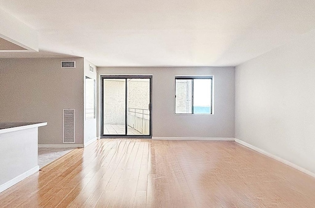 spare room featuring light hardwood / wood-style flooring