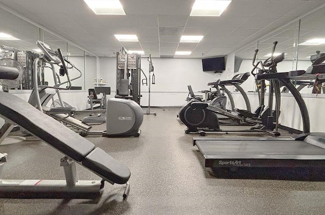 exercise room featuring a drop ceiling