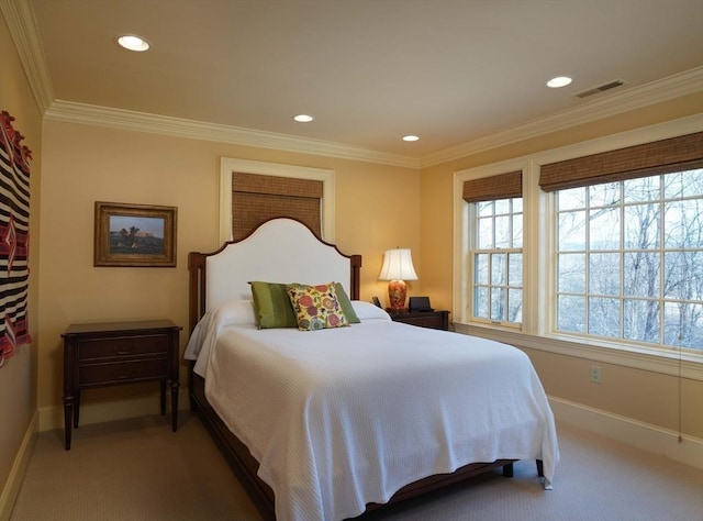 bedroom with carpet floors and ornamental molding