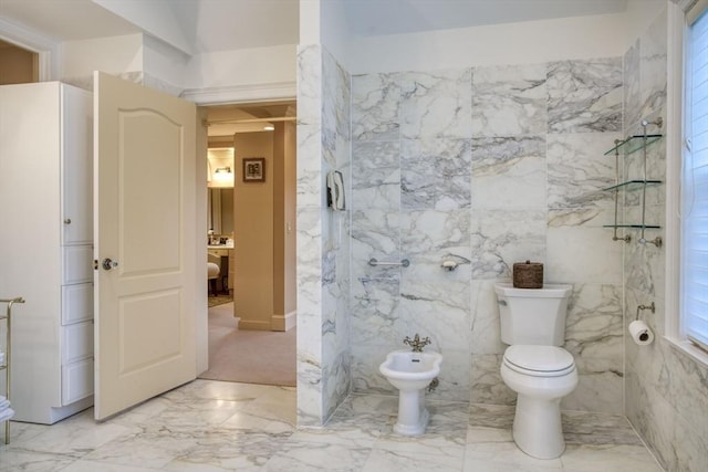 bathroom featuring toilet and a bidet