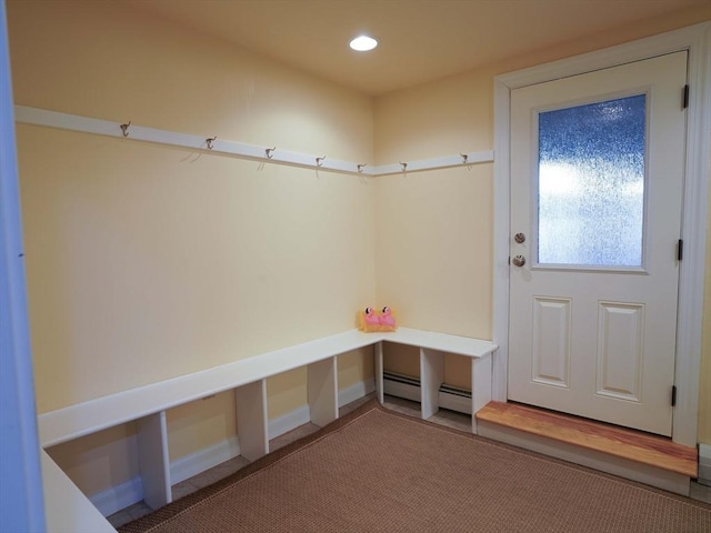 mudroom with carpet flooring and a baseboard radiator