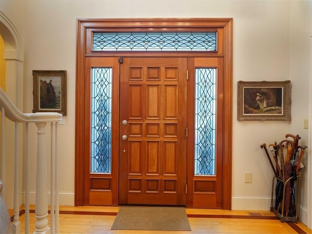 entrance foyer with light wood-type flooring and plenty of natural light