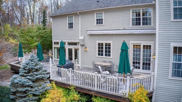 rear view of property with a wooden deck