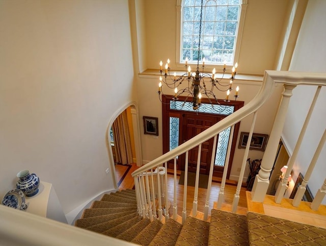 entryway with a chandelier