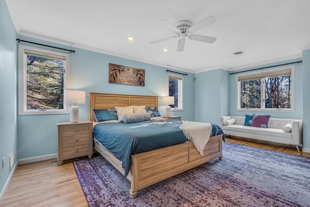 bedroom with visible vents, baseboards, recessed lighting, light wood-style floors, and crown molding