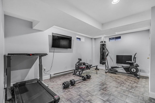 workout area featuring baseboards