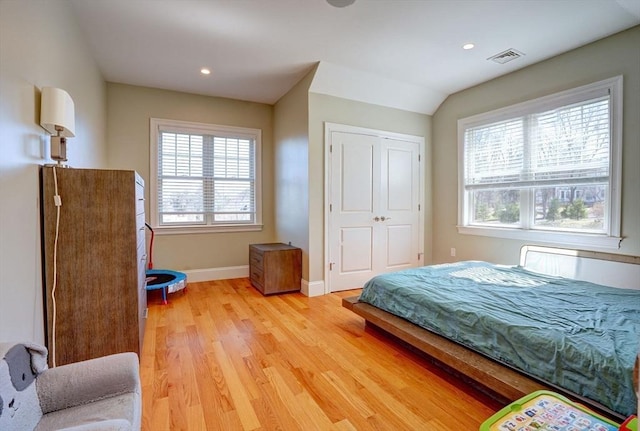 bedroom with light wood-style flooring, baseboards, and recessed lighting